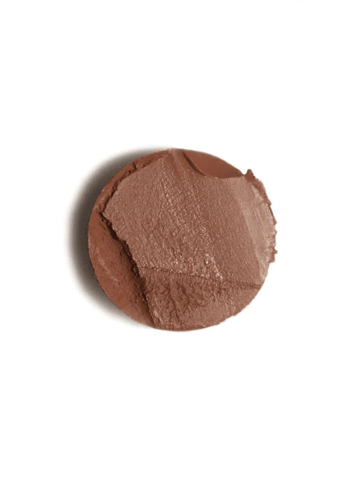 Brown contour makeup swatch of 19/99 Beauty Cream Contour Stick in 'Tea' on a white background | Twentyseven Toronto
