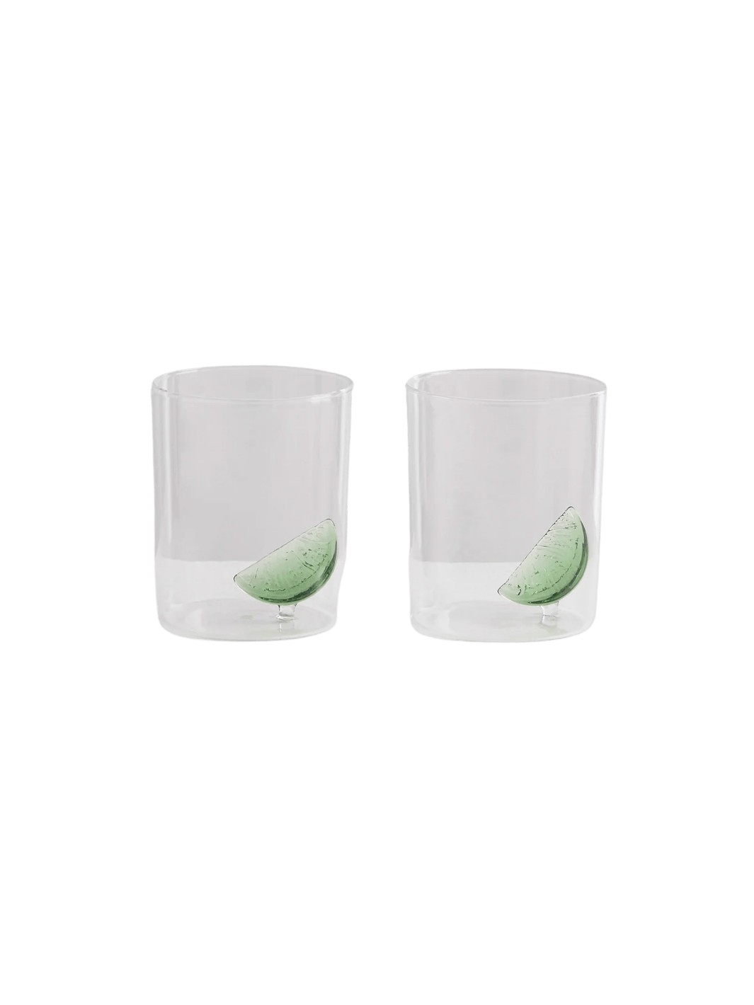 Two clear gin and tonic gobelets with glass lime wedges from Maison Balzac on a transparent background | Twentyseven Toronto
