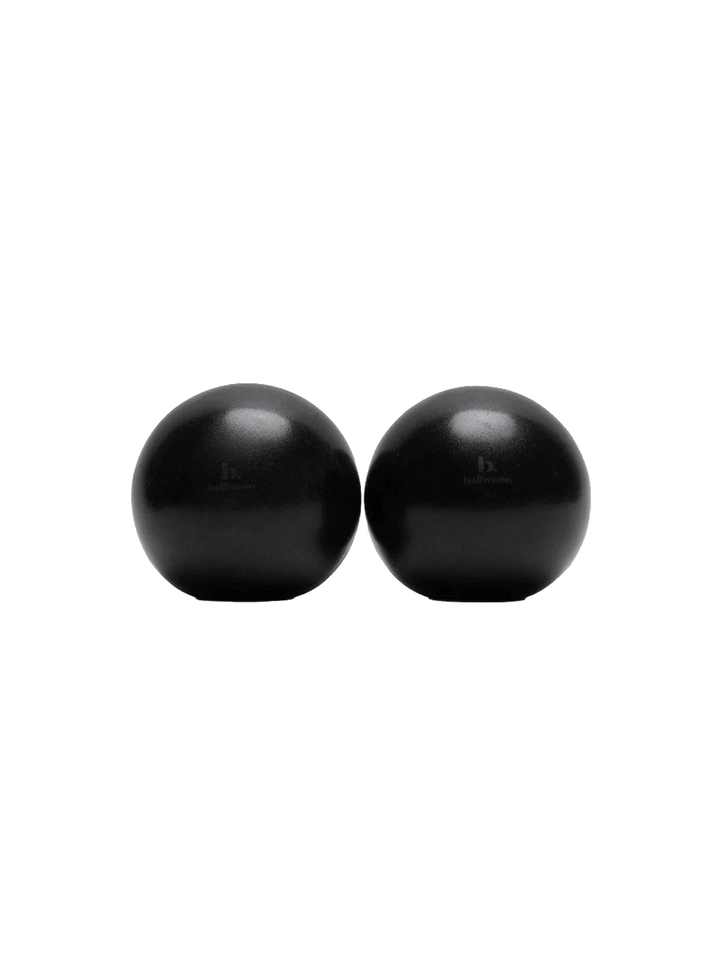 1. Pair of black Halfmoon 2 lb Sphere Weights on a white background | Twentyseven Toronto