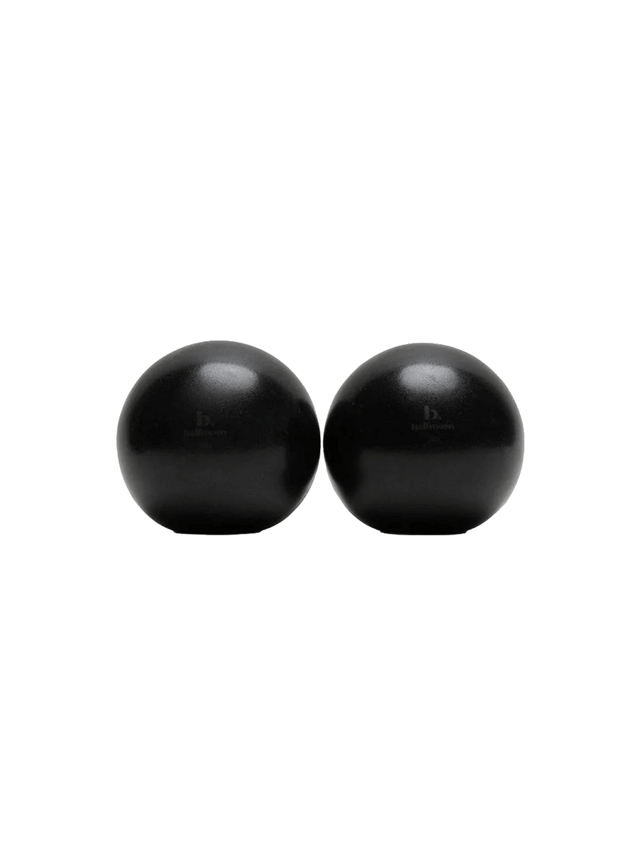 1. Pair of black Halfmoon 2 lb Sphere Weights on a white background | Twentyseven Toronto