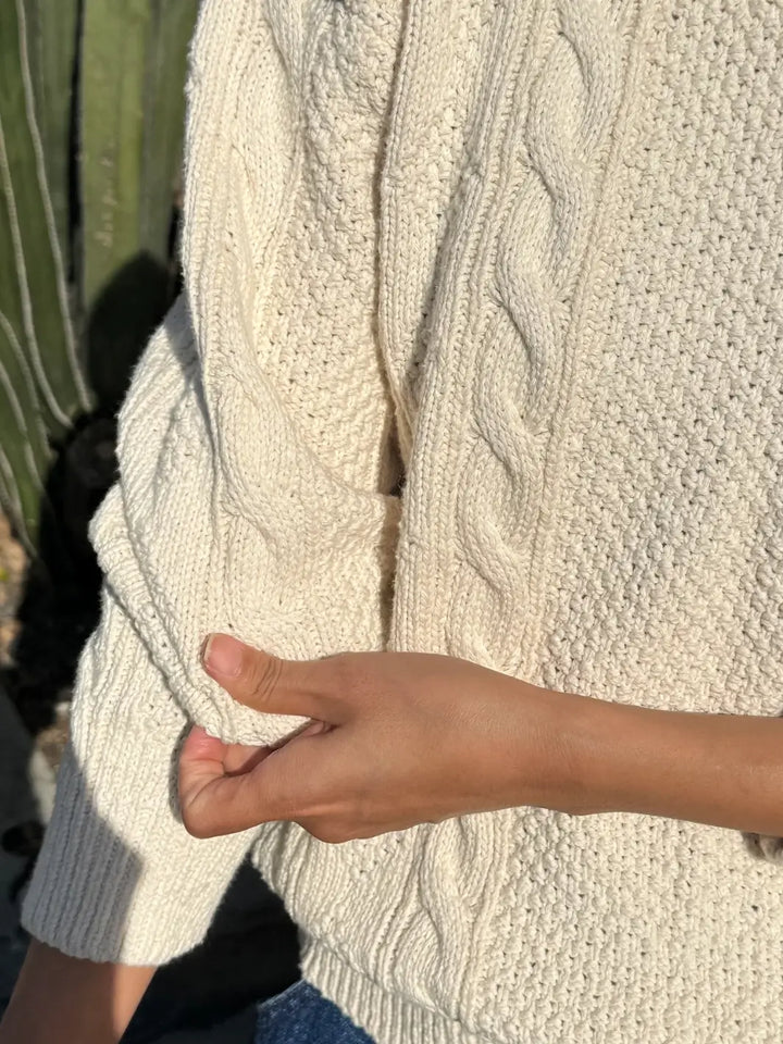 A close-up detail shot of the sleeve and woven texture on the Le Bon Shoppe Cotton Fisherman Sweater in Naturel | Twentyseven