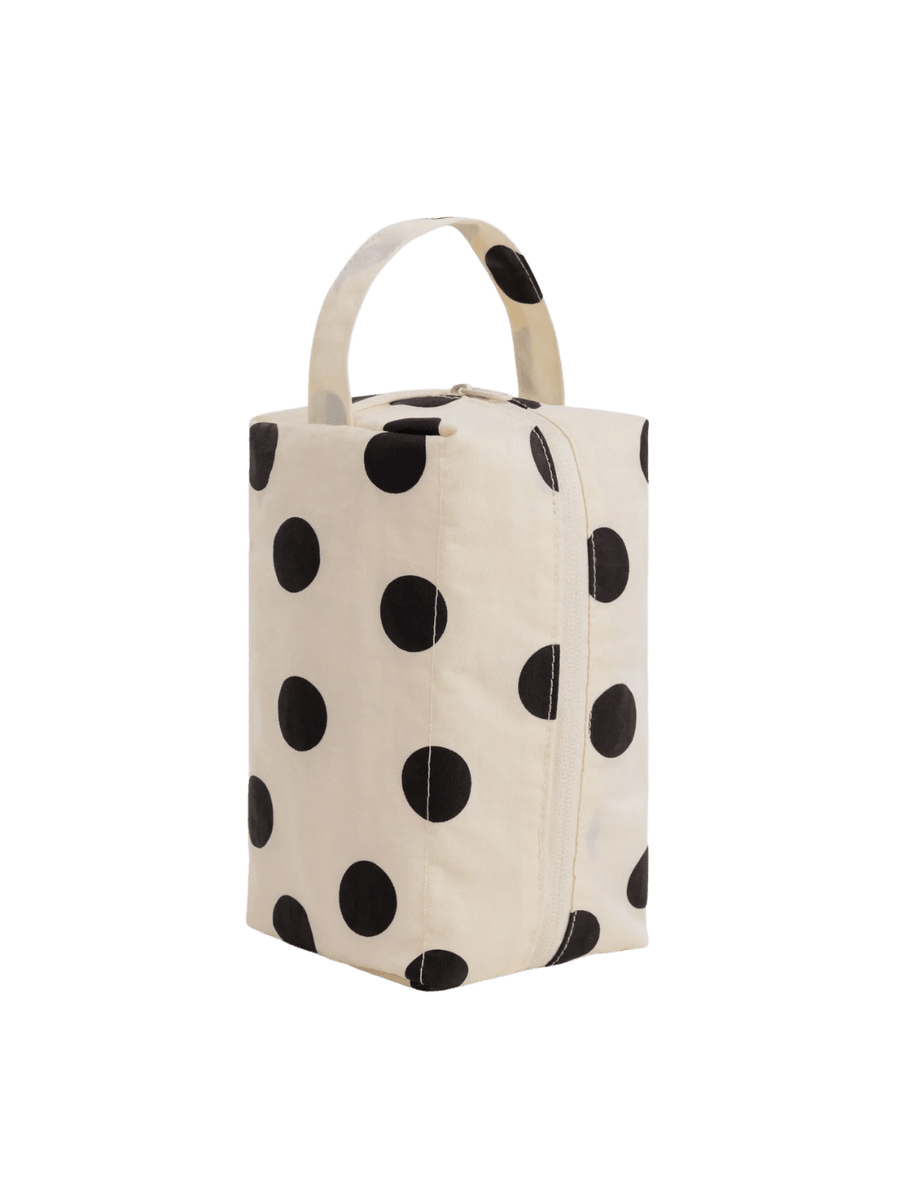 A studio product shot of the BAGGU Dopp Kit in Cream and Black Polka Dot standing upright | Twentyseven