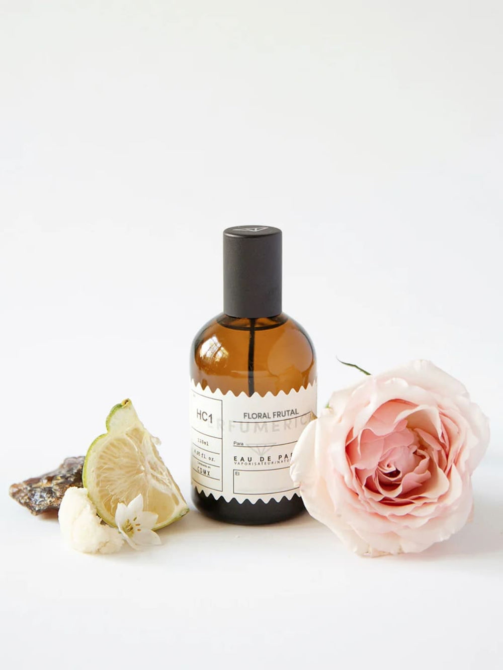 Brown perfume bottle with a black cap, the fragrance 'HC1 Floral Fruit Eau de Parfum' from Perfumérica, 120ml, with natural ingredients on a white background | Twentyseven Toronto