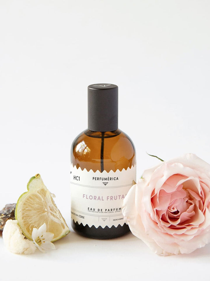Brown perfume bottle with a black cap, the fragrance 'HC1 Floral Fruit Eau de Parfum' from Perfumérica, 120ml, with natural ingredients on a white background | Twentyseven Toronto