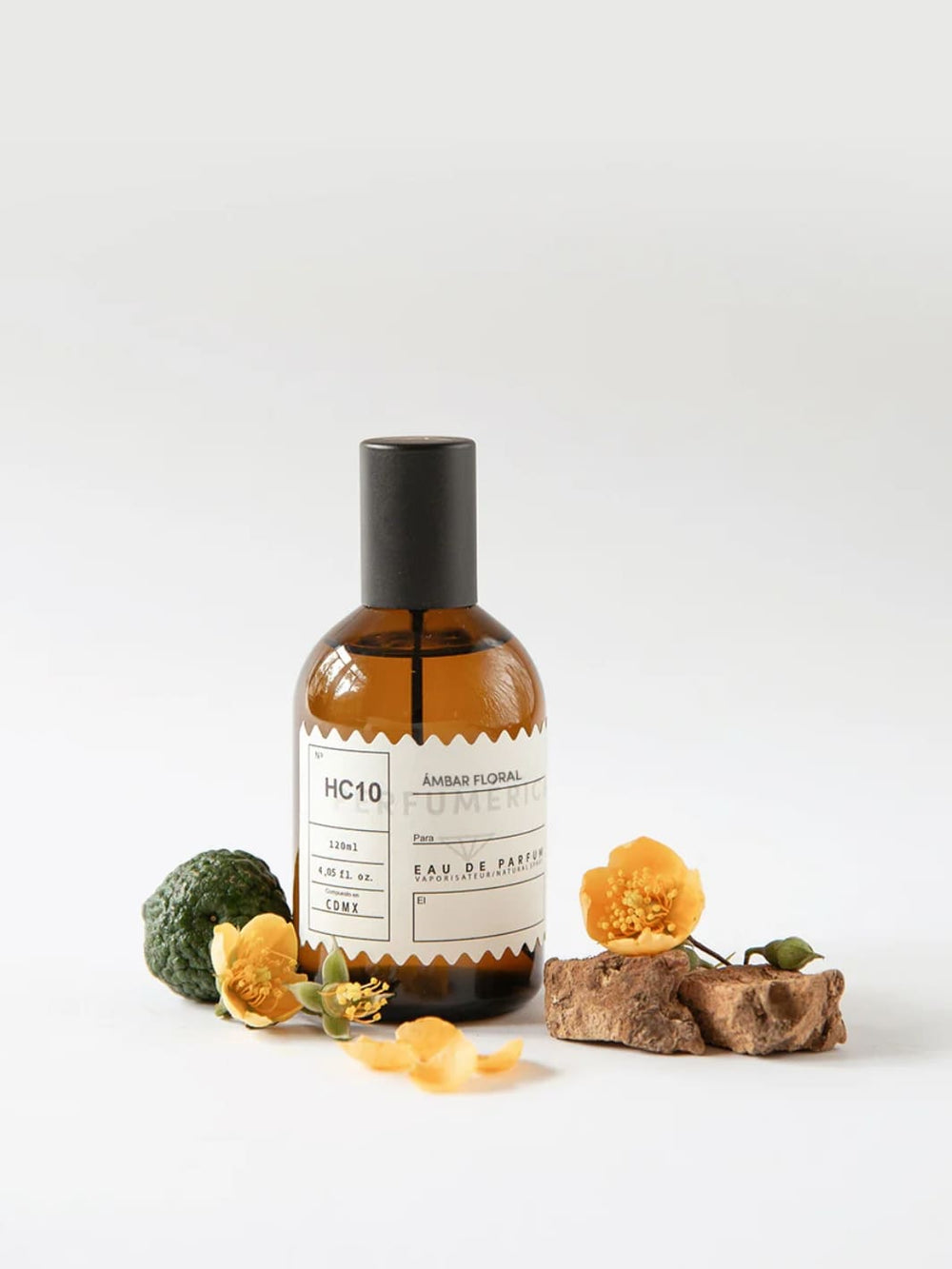 Brown perfume bottle with a black cap, the fragrance 'HC10 Amber Floral Eau de Parfum' from Perfumérica, 120ml, with natural ingredients on a white background | Twentyseven Toronto