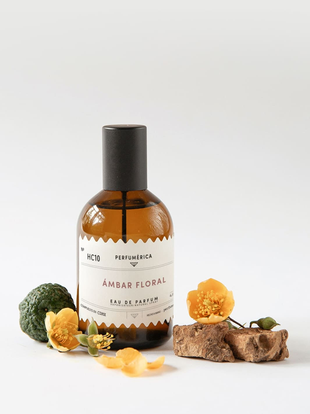 Brown perfume bottle with a black cap, the fragrance 'HC10 Amber Floral Eau de Parfum' from Perfumérica, 120ml, with natural ingredients on a white background | Twentyseven Toronto