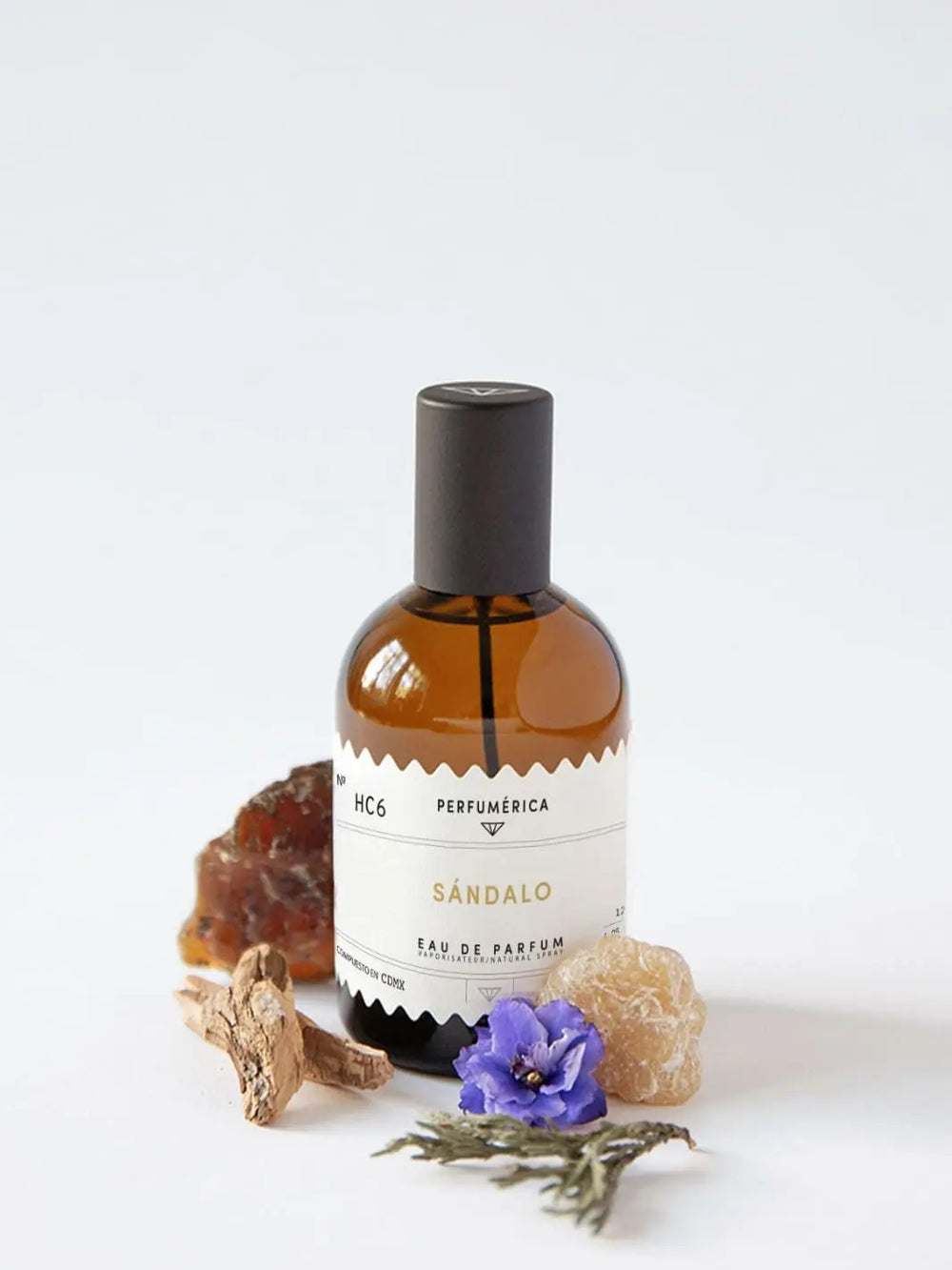 Brown perfume bottle with a black cap, the fragrance 'HC6 Sandalwood Eau de Parfum' from Perfumérica, 120ml, with natural ingredients on a white background | Twentyseven Toronto