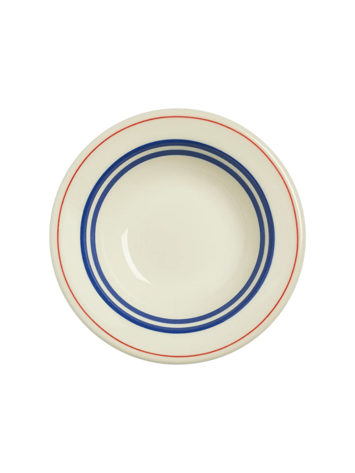 A direct top-down view of an off-white HL Red/Blueband - Fruit Bowl (4 oz) from Fishs Eddy, showcasing the concentric blue and red circular stripes from above | Twentyseven Toronto