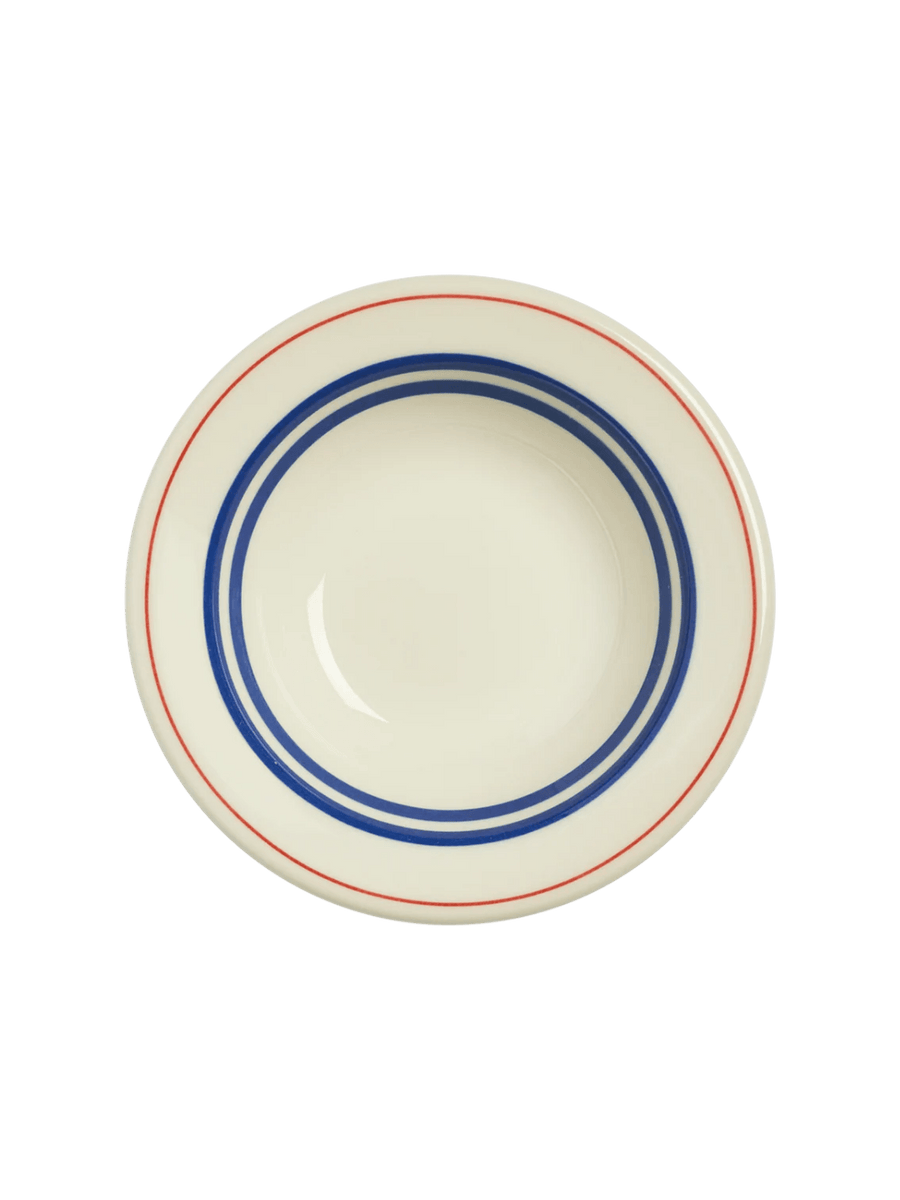 A direct top-down view of an off-white HL Red/Blueband - Fruit Bowl (4 oz) from Fishs Eddy, showcasing the concentric blue and red circular stripes from above | Twentyseven Toronto
