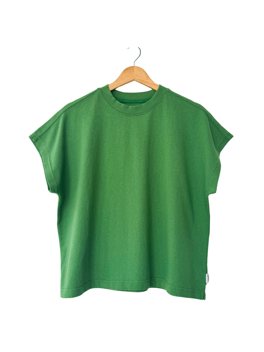 A studio product shot of the short-sleeve Le Bon Shoppe Jeanne Tee in Asparagus hanging on a wooden hanger | Twentyseven