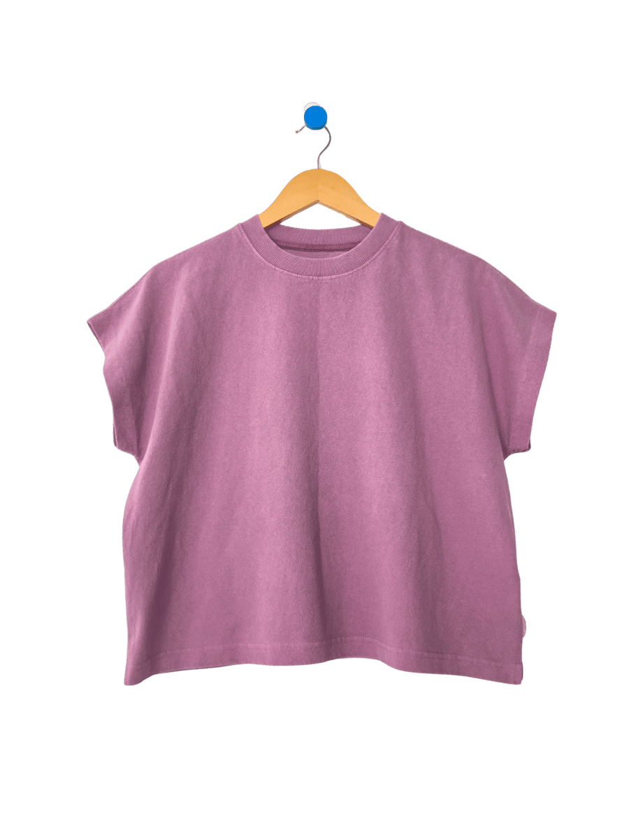 A studio product shot of the short-sleeve Le Bon Shoppe Jeanne Tee in Dusty Lilac hanging on a wooden hanger | Twentyseven
