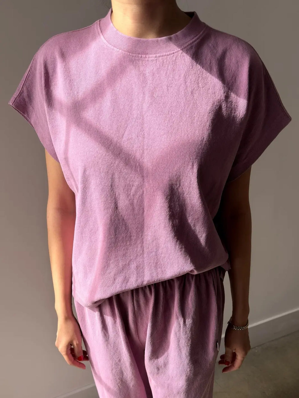 A front view of a model wearing the short-sleeve Le Bon Shoppe Jeanne Tee in Dusty Lilac paired with matching dusty lilac pants | Twentyseven