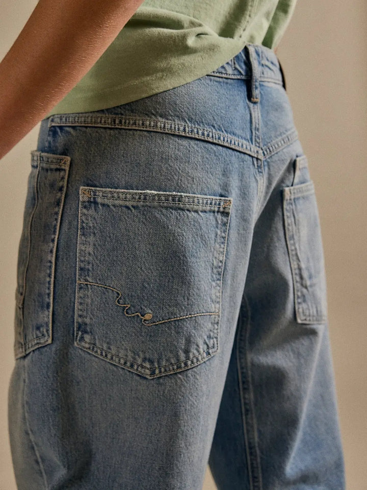 Close-up of the back pockets featuring subtle decorative stitching on the Free People We the Free Minimalist Moxie Barrel Jeans in County Fair | Twentyseven