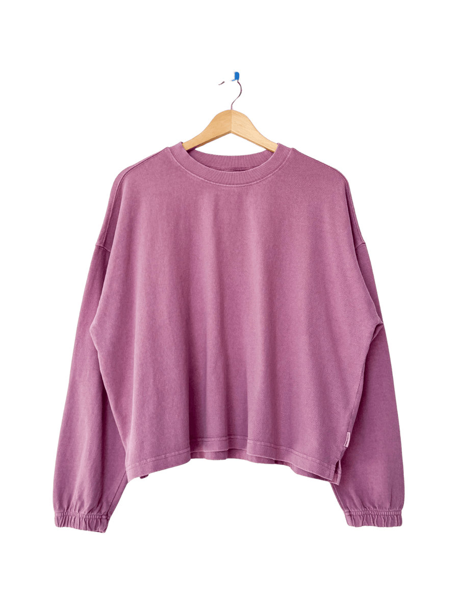 A studio product shot of the long-sleeve Le Bon Shoppe Naturelle Tee in Dusty Lilac on a wooden hanger | Twentyseven