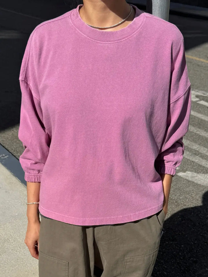 A front view shot of a model wearing the long-sleeve Le Bon Shoppe Naturelle Tee in Dusty Lilac paired with olive green pants | Twentyseven