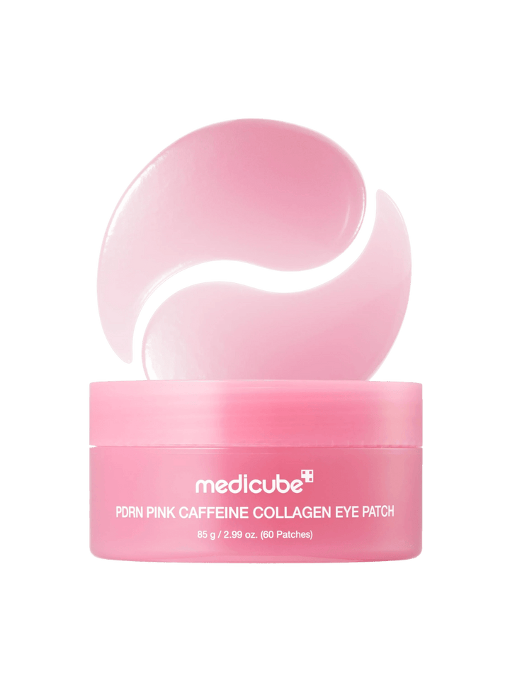 A studio product shot of the pink Medicube PDRN Caffeine Collagen Eye Patch jar displayed with two gel patches forming a crescent shape above it | Twentyseven