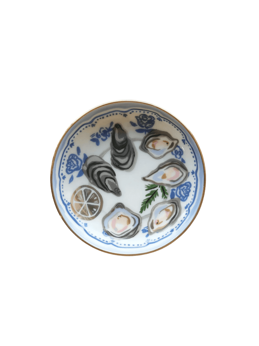 A clean studio shot of the Idlewild Co. Oysters Porcelain Trinket Dish, showing its gold-rimmed edge and blue floral-bordered oyster platter design | Twentyseven