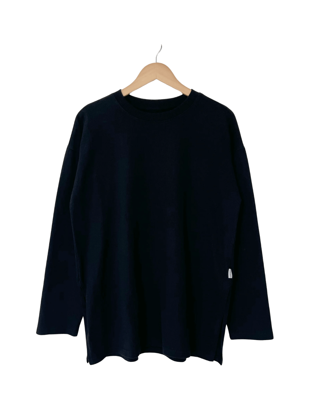 A studio product shot of the dark long-sleeve Le Bon Shoppe Sunday Tee in Black displayed on a wooden hanger | Twentyseven