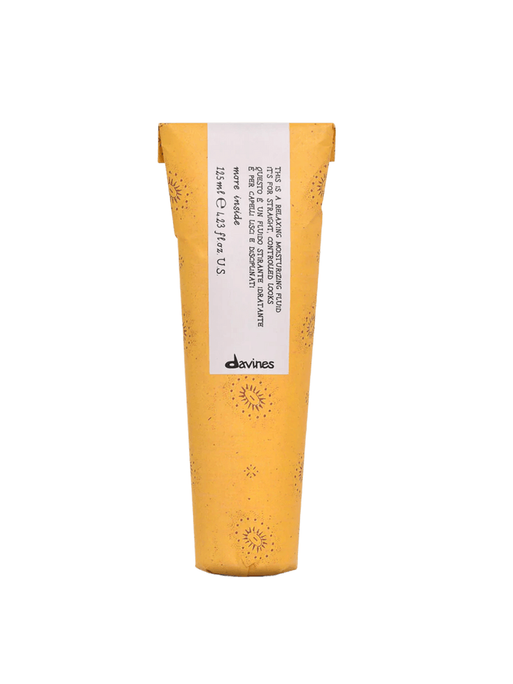 Front view of Davines This is a Relaxing Moisturizing Fluid in its yellow sun-patterned paper wrapper | Twentyseven