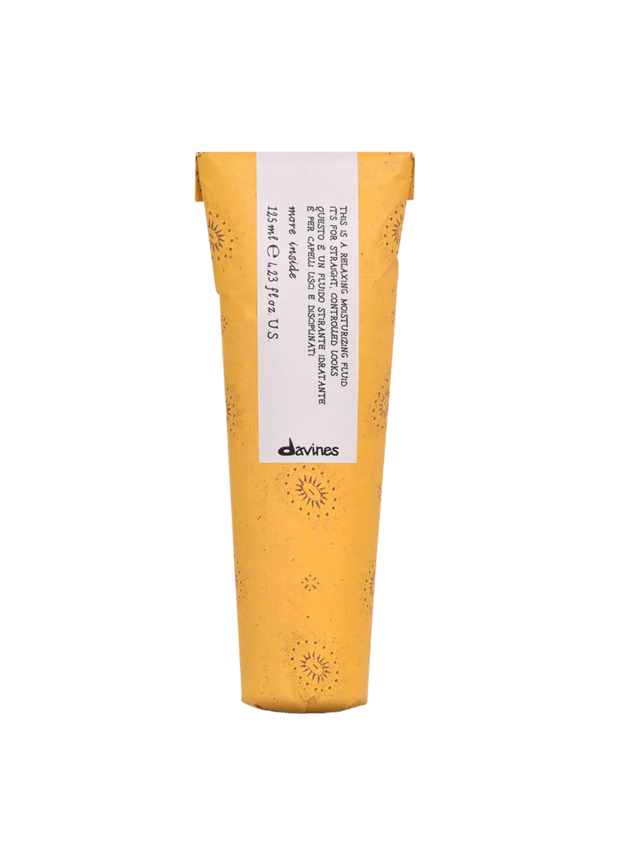 Front view of Davines This is a Relaxing Moisturizing Fluid in its yellow sun-patterned paper wrapper | Twentyseven