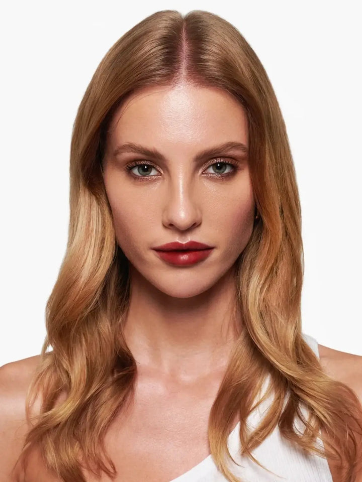 Front-facing portrait of a blonde woman wearing the rich rose-toned shade of the Wonderskin WONDER BLADING Peel & Reveal Lip Color Kit in Charming | Twentyseven