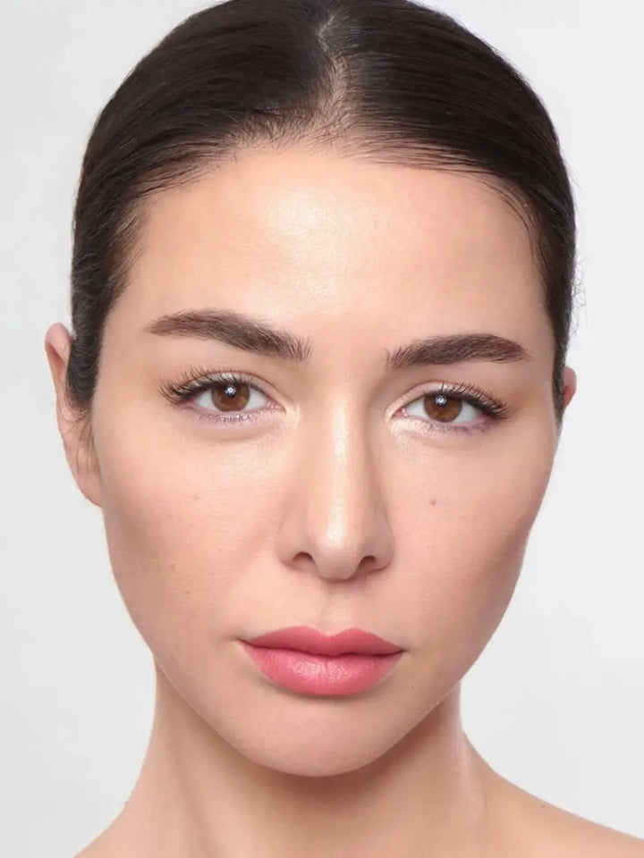 Portrait of a woman with brown hair slicked back wearing the soft stain of the Wonderskin WONDER BLADING Peel & Reveal Lip Color Kit - Romance | Twentyseven