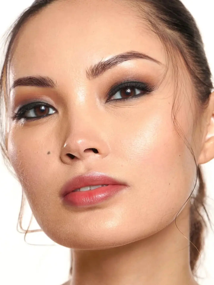 Close-up portrait of a woman wearing the rosy-pink finish of the Wonderskin WONDER BLADING Peel & Reveal Lip Color Kit - XOXO | Twentyseven