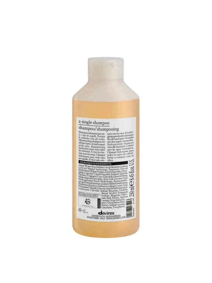 The back label of a Davines A Single Shampoo bottle is displayed clearly against a white background, showing the product description and ingredients list | Twentyseven Toronto