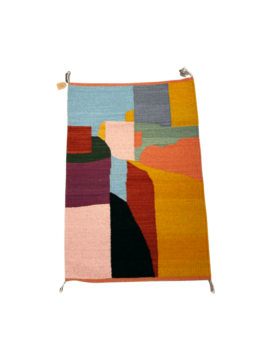 Handwoven abstract rug featuring geometric colour blocking in mustard, blush, burgundy, sage green, charcoal, and pale blue tones with organic curved shapes | Twentyseven Toronto