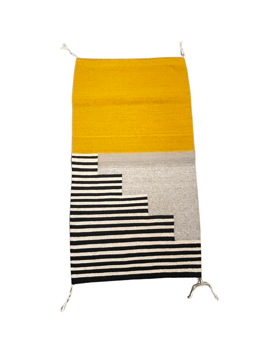 Handwoven modern rug with a mustard yellow upper half and stepped black-and-cream striped pattern along the bottom on a soft grey background | Twentyseven Toronto