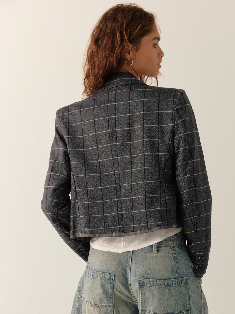 Back view of the Free People Academia Blazer in Charcoal Combo showing its cropped silhouette, structured shoulders and windowpane plaid | Twentyseven Toronto