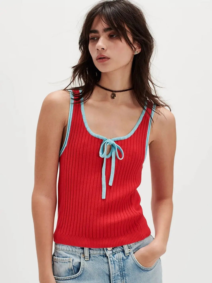 A front view shows a model with dark hair wearing the red ribbed Free People All Star Sweater Tank - Atlas Red Combo, featuring contrasting light blue trim and a front keyhole tie | Twentyseven Toronto