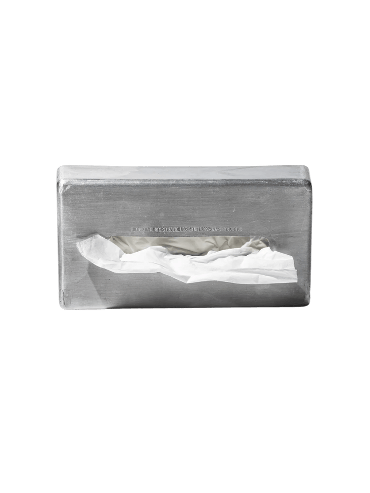 Rectangular Aluminum Tissue Case from Puebco holds a tissue against a transparent background | Twentyseven Toronto