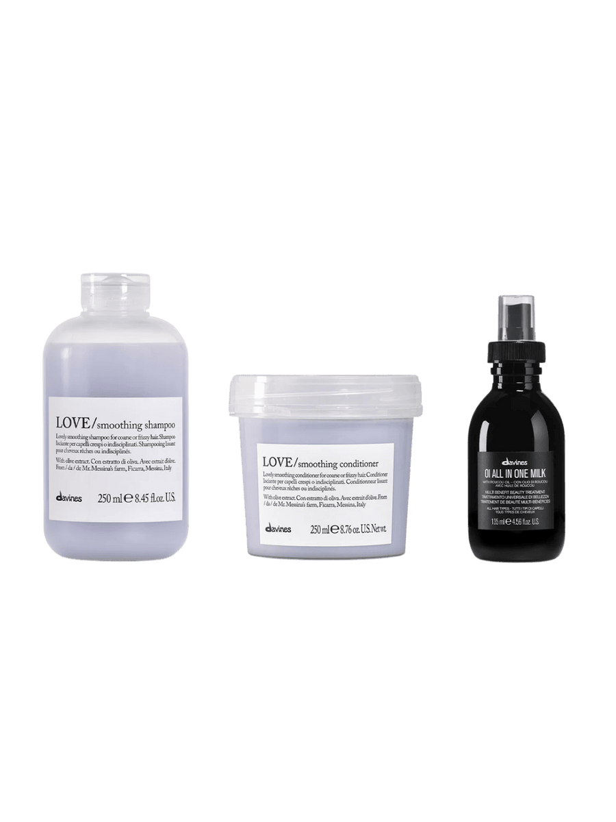 Three Davines hair care products including LOVE Smoothing Shampoo (250ml), LOVE Smoothing Conditioner (250ml) and OI All in One Milk (135ml) on a transparent background | Twentyseven Toronto