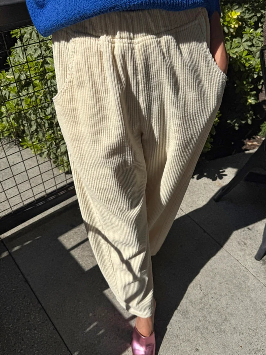 Le Bon Shoppe Soft Corduroy Arc Pants in Ecru worn outdoors, front view showing elastic waist and deep pockets | Twentyseven Toronto