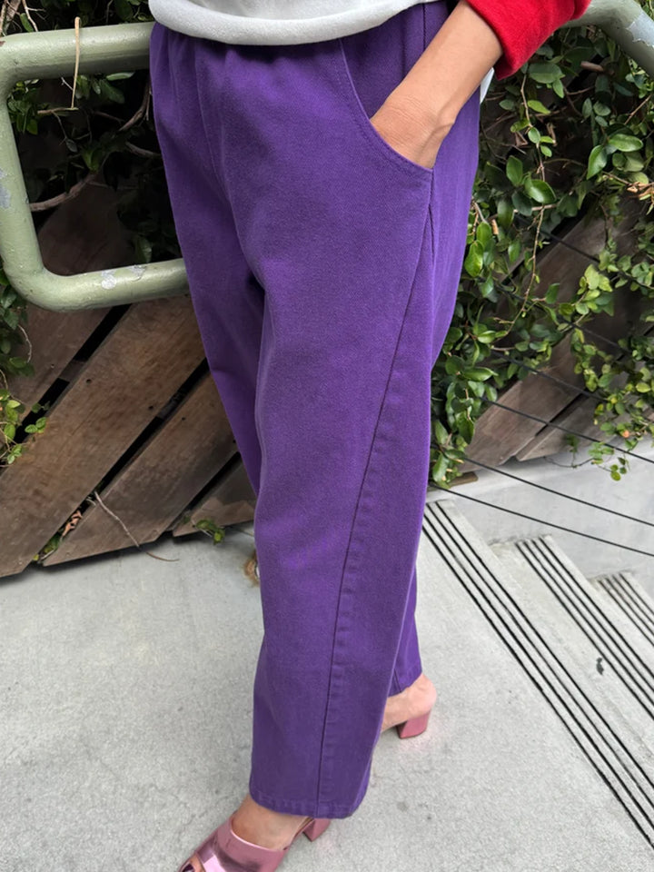 Side view of Le Bon Shoppe Arc Pants in Eggplant, showing the curved pocket and seam detailing | Twentyseven Toronto