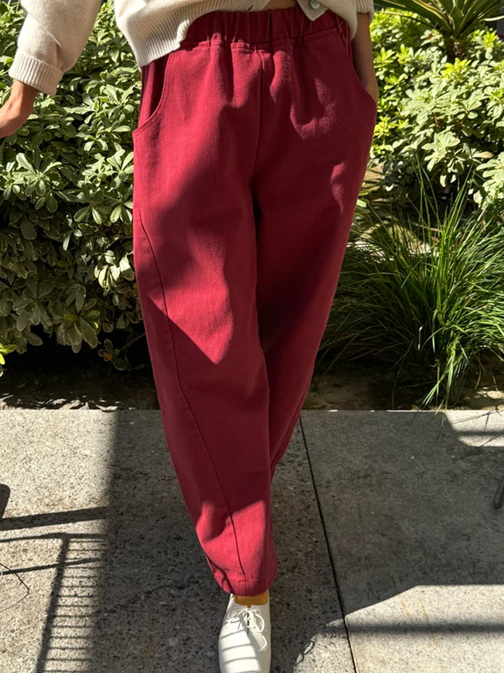 Model wearing Le Bon Shoppe Arc Pants in Oxblood, showing the relaxed tapered silhouette | Twentyseven Toronto