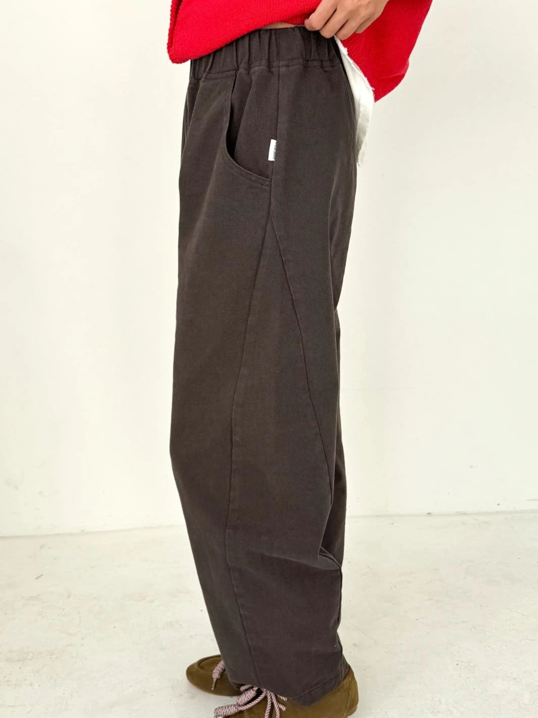 Brown Arc Pants in 'Umber' from Le Bon Shoppe worn by a person, side view | Twentyseven Toronto