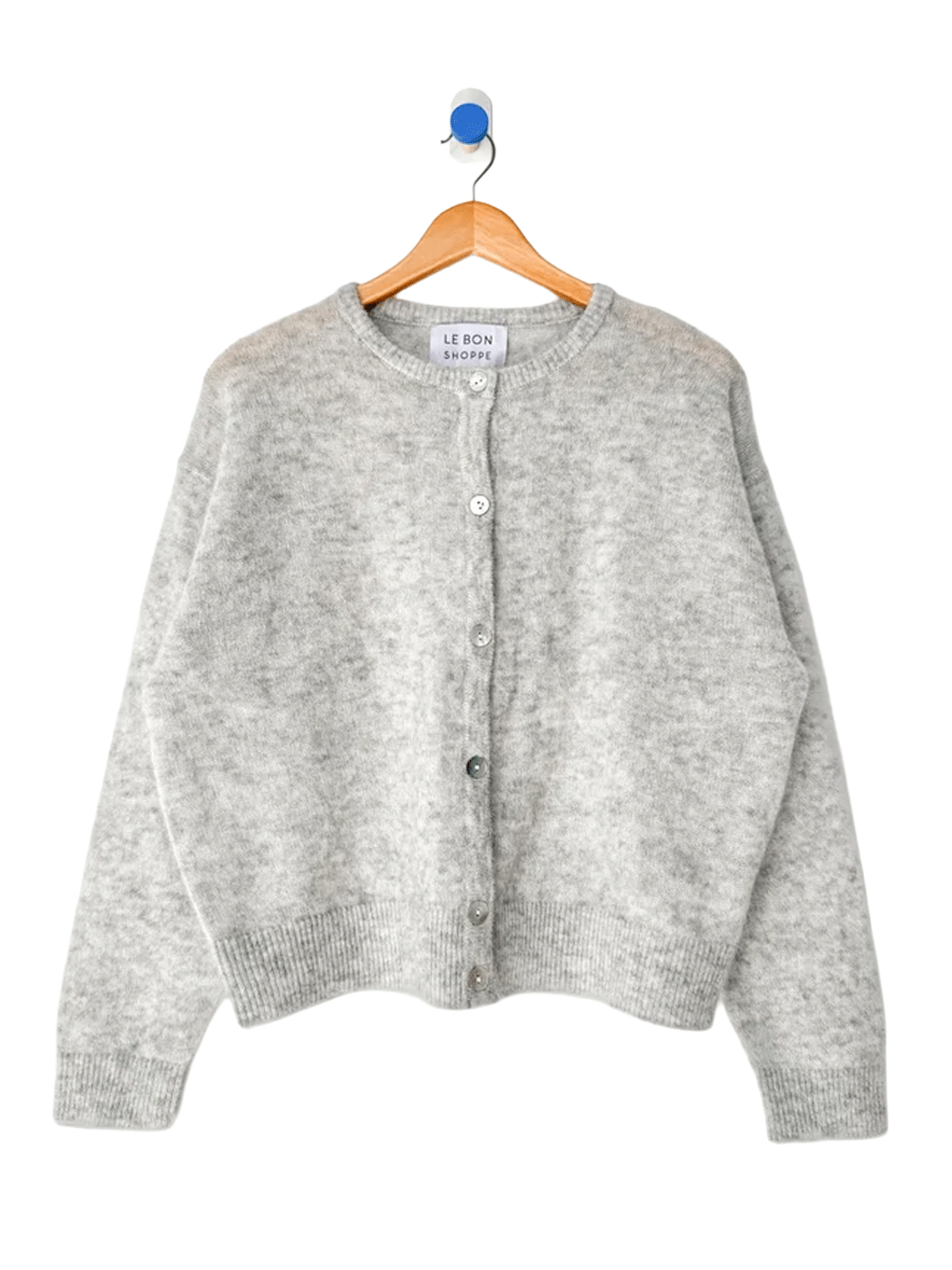 Le Bon Shoppe Ayla Mohair Cardigan in Heather Grey displayed on a wooden hanger, featuring a crew neckline and shell button front | Twentyseven Toronto