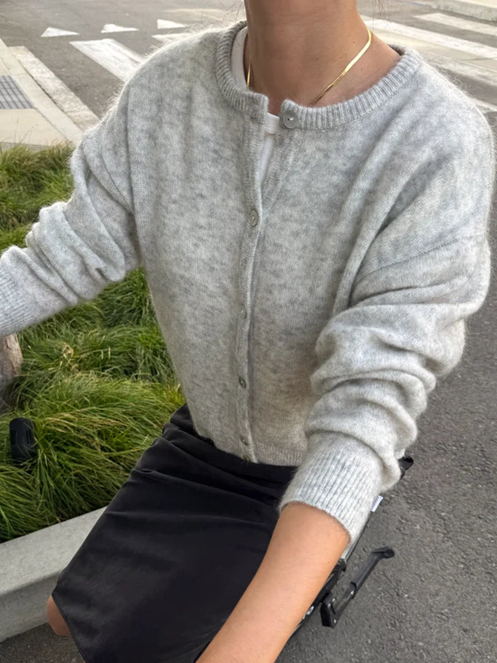 Le Bon Shoppe Ayla Mohair Cardigan in Heather Grey styled with a black skirt, featuring a relaxed silhouette and shell button front | Twentyseven Toronto