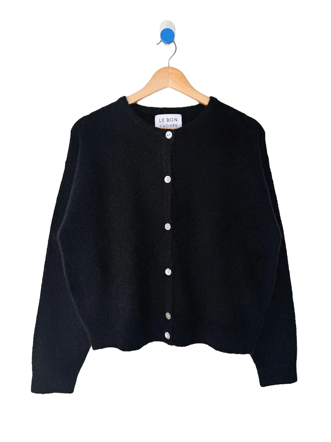 Le Bon Shoppe Ayla Mohair Cardigan in Onyx displayed on a wooden hanger, featuring a relaxed fit and shell button front | Twentyseven Toronto