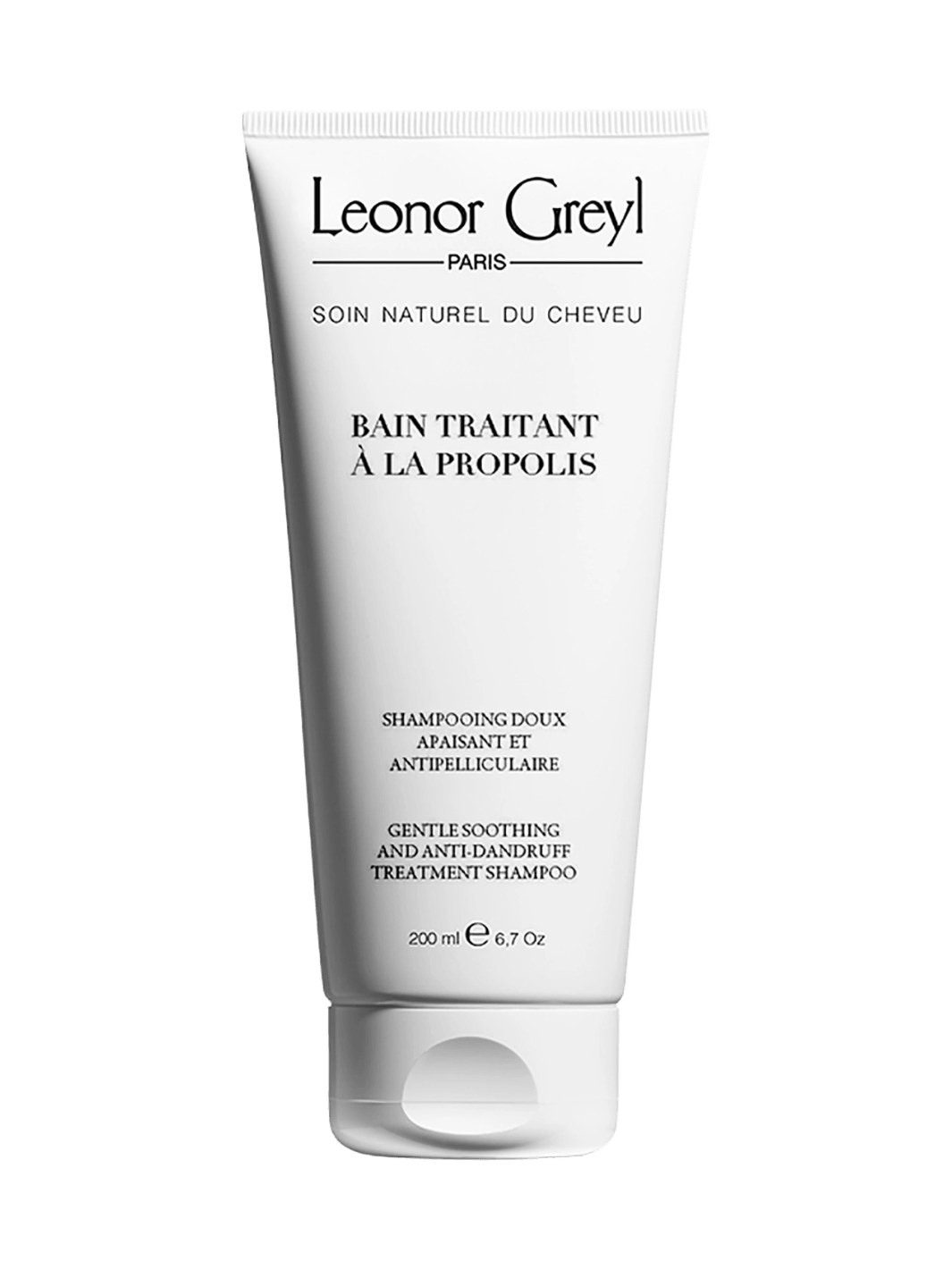 Leonor Greyl 'Bain Traitant à la Propolis' shampoo bottle on a transparent background | Twentyseven Toronto