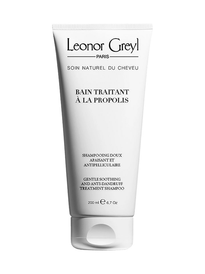 Leonor Greyl 'Bain Traitant à la Propolis' shampoo bottle on a transparent background | Twentyseven Toronto