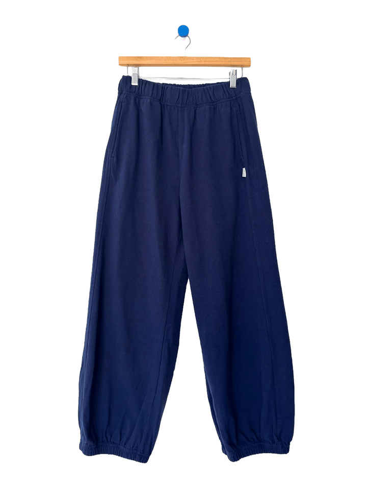 Le Bon Shoppe Balloon Pants in Midnight on a wooden hanger against a white background | Twentyseven Toronto
