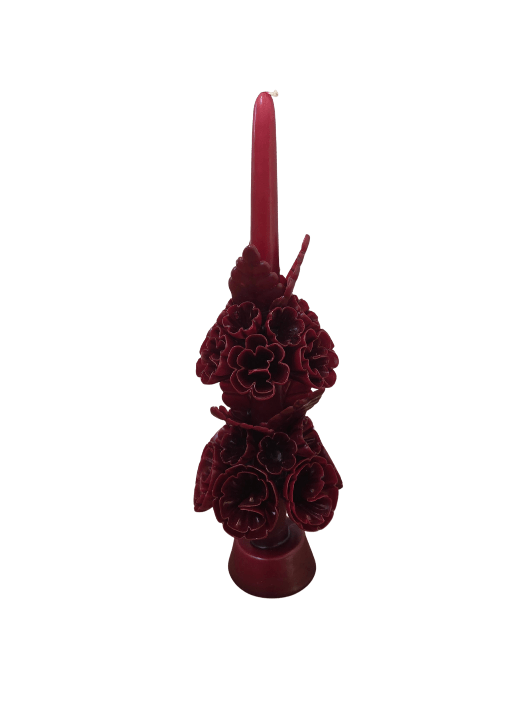 Dark red floral wax candle called the Banderilla Scaled Candle in Burgundy from Cereria de Jesus against a transparent background | Twentyseven Toronto
