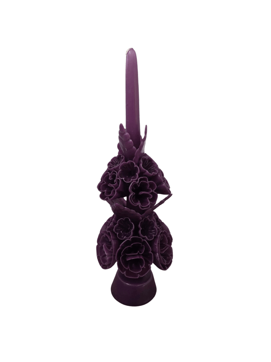 Dark purple floral wax candle called the Banderilla Scaled Candle from Cereria de Jesus against a transparent background | Twentyseven Toronto