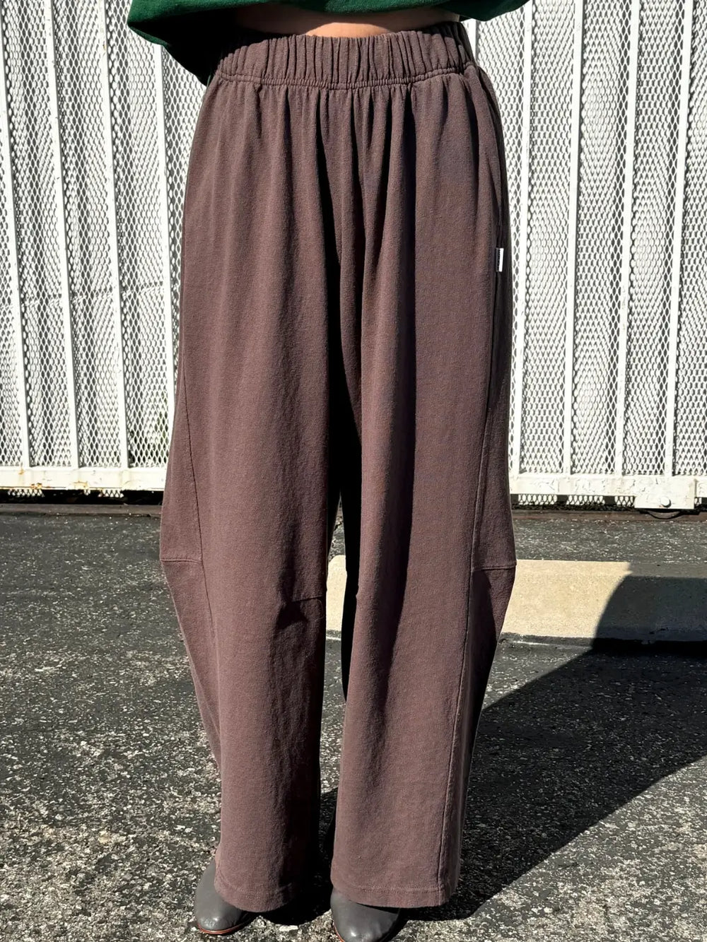 Person wearing dark brown wide-leg Bare Pants in 'Chocolate' from Le Bon Shoppe in an outdoor setting | Twentyseven Toronto