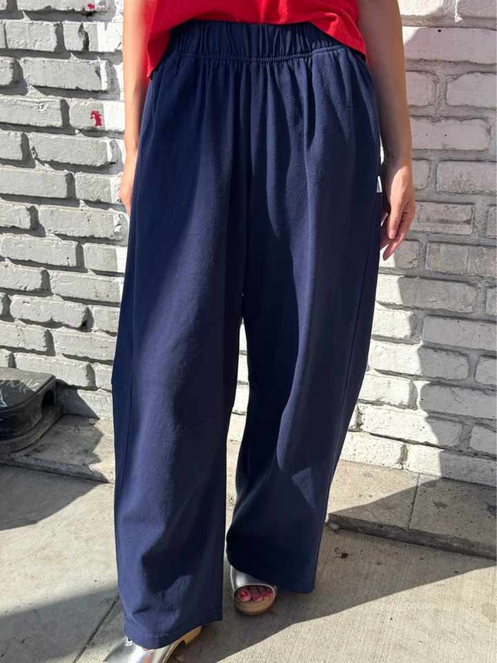 Model wearing Le Bon Shoppe Bare Pants in Midnight with a red top | Twentyseven Toronto