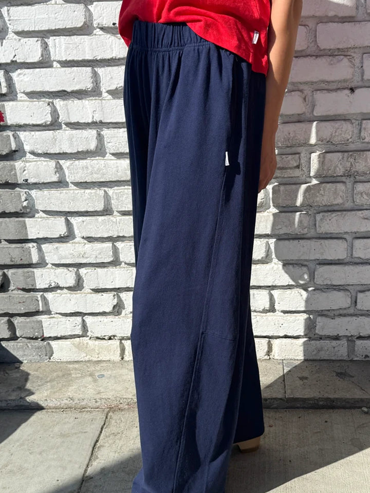 Side view of model wearing Le Bon Shoppe Bare Pants in Midnight, showing the relaxed wide-leg fit| Twentyseven Toronto