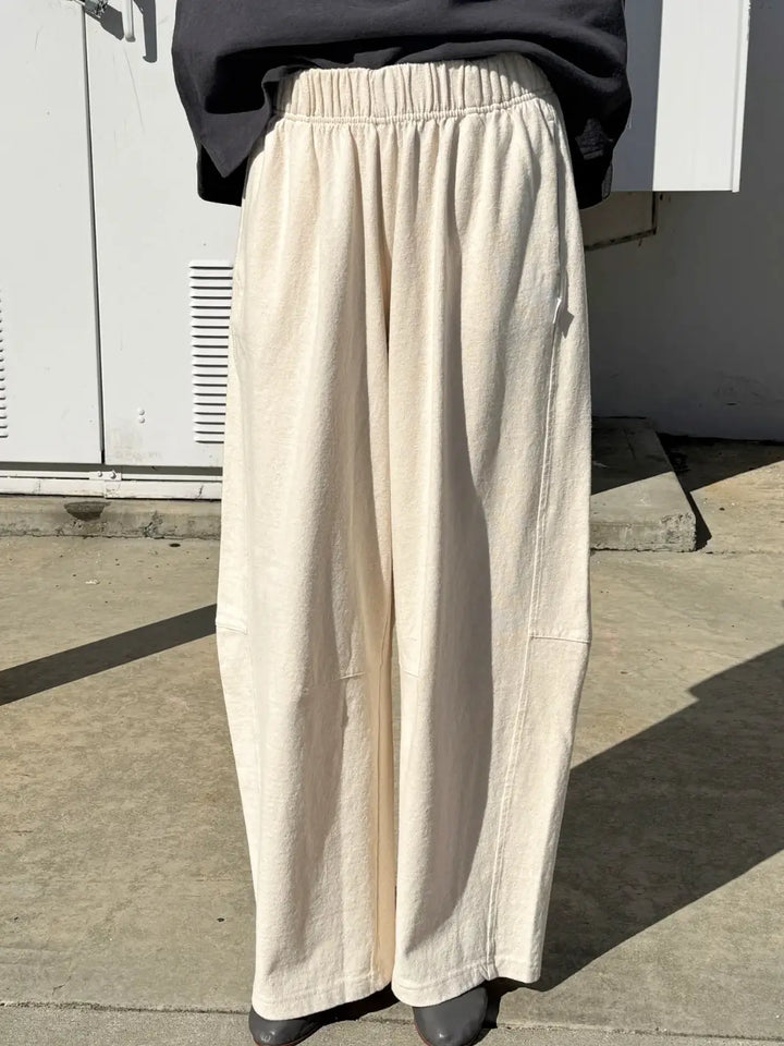 Person wearing cream wide-leg Bare Pants in 'Naturel' from Le Bon Shoppe in an outdoor setting | Twentyseven Toronto
